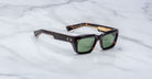 Jacques Marie Mage Walker sunglasses with green lenses, shown from above.