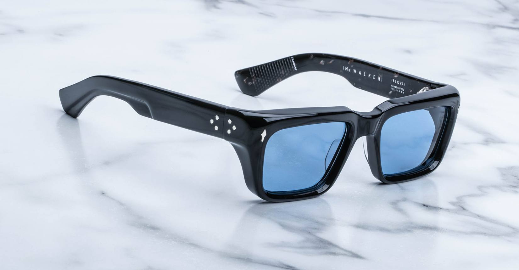 Jacques Marie Mage Walker rectangular black sunglasses with blue lenses, top view.