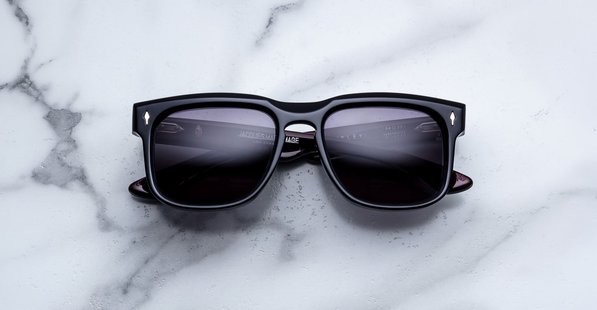 Jacques Marie Mage Wesley black polarized sunglasses with dark lenses, top view, showing front frame and temples.