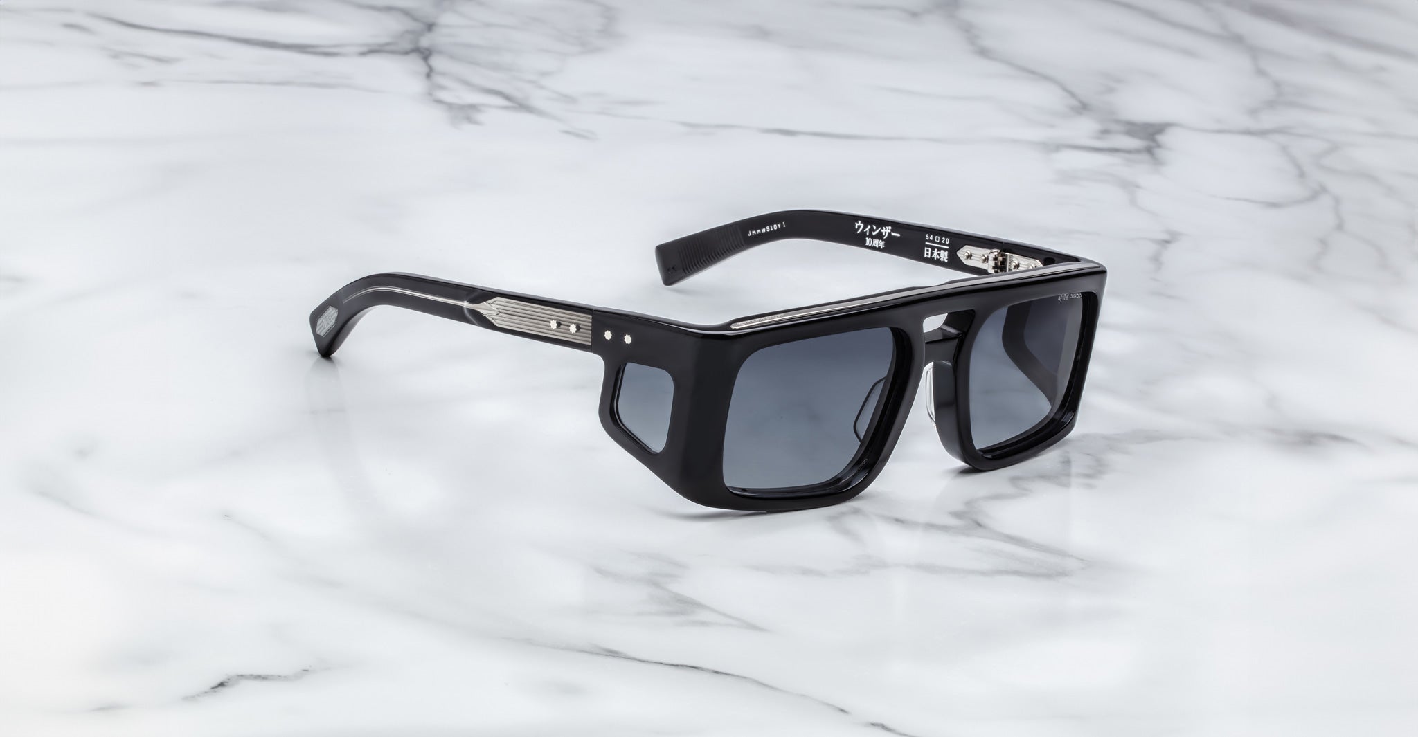Jacques Marie Mage Windsor black rectangular sunglasses with thick frames, viewed from above.