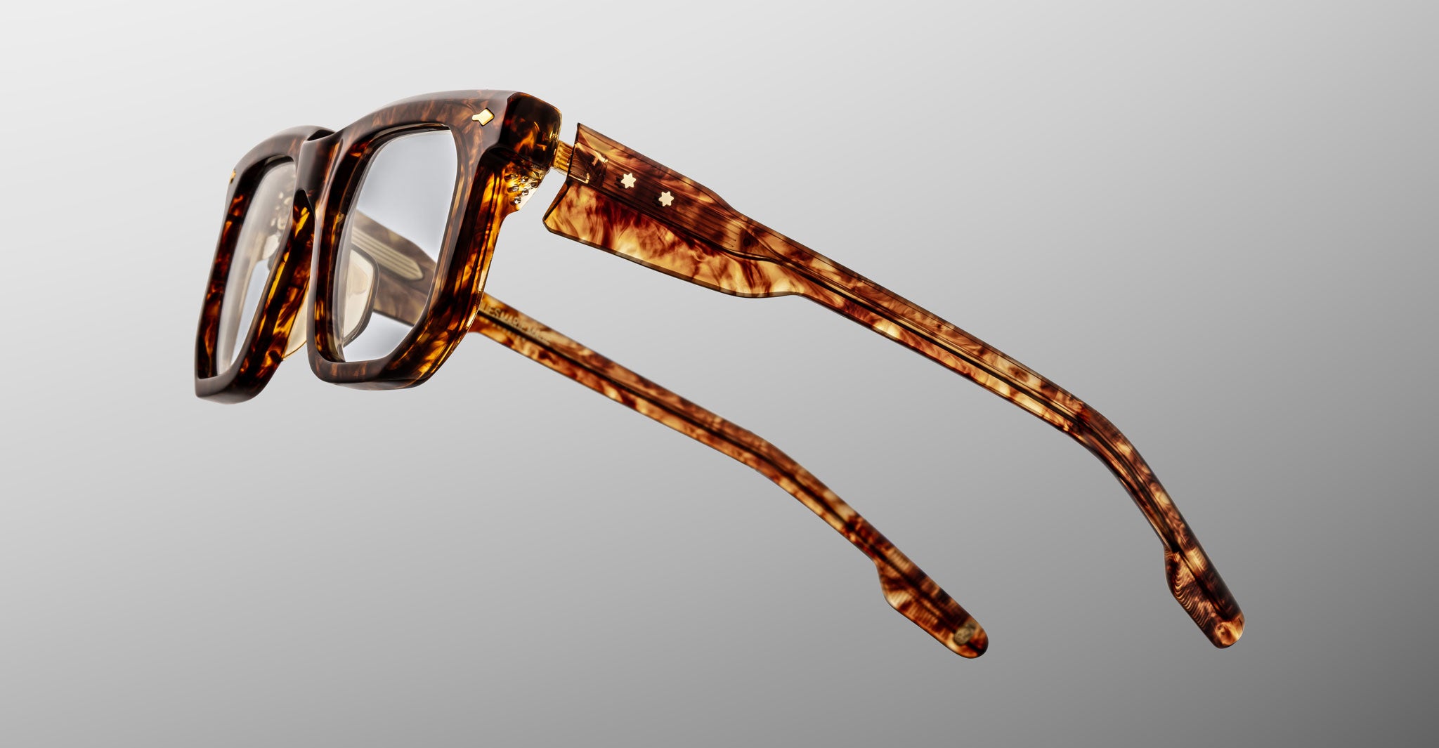 Jacques Marie Mage Yoshi in Argyle eyeglasses close-up showing temple construction and hardware detailing