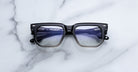 Jacques Marie Mage Yoshi in Black Fade eyeglasses with thick acetate rims and subtle gradient transition