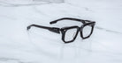 Jacques Marie Mage Yoshi Black acetate spectacles angled view with structured front and medium fit design