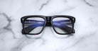 Jacques Marie Mage Yves black rectangular eyeglasses with clear lenses, front view.
