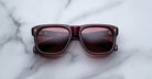 Jacques Marie Mage Yves dark red polarized sunglasses with tinted lenses shown from above.