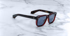 Jacques Marie Mage Yves tortoiseshell polarized sunglasses with dark lenses, top view, eyewear product photography.