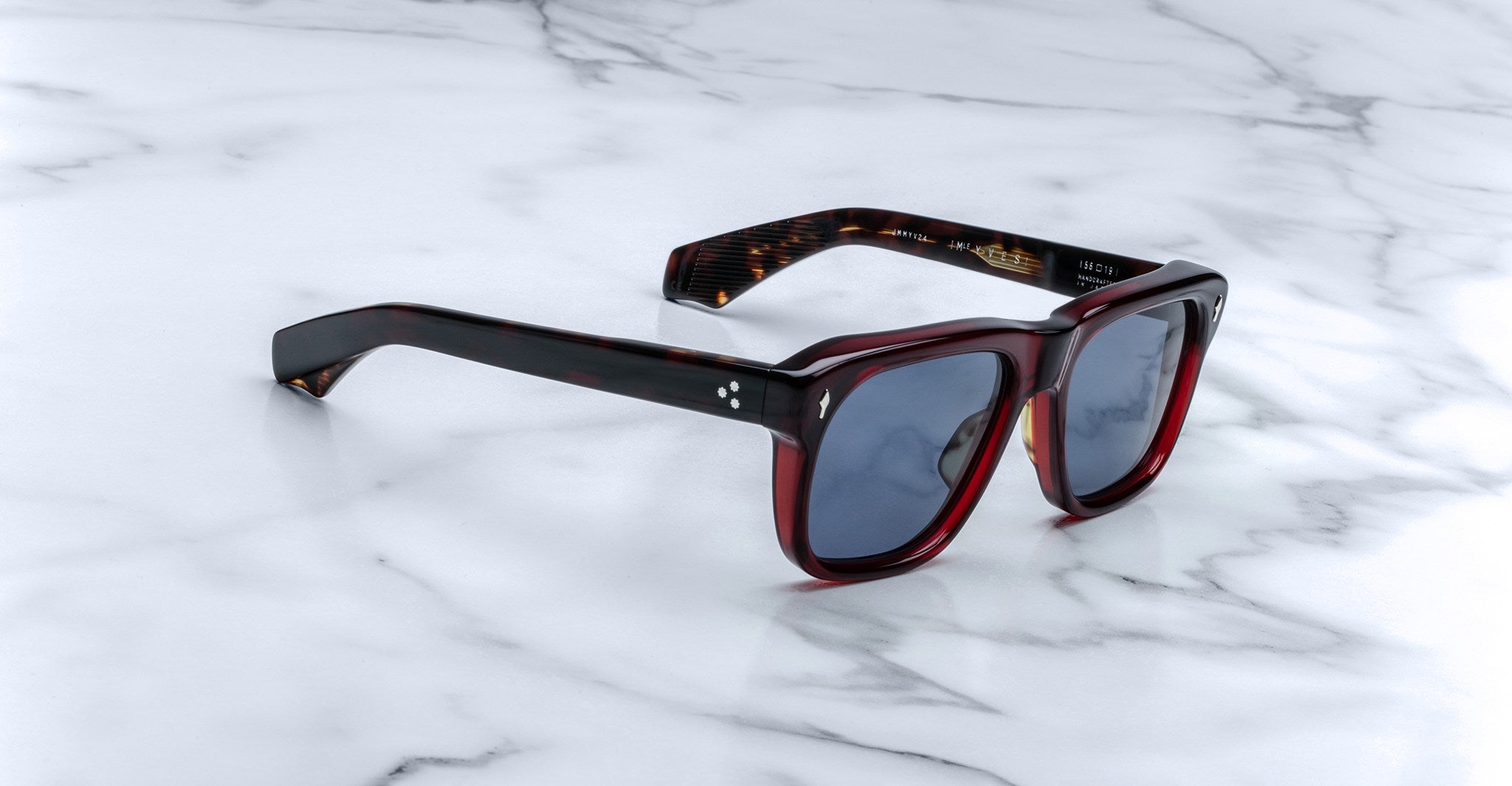 Jacques Marie Mage Yves tortoiseshell polarized sunglasses with dark lenses, top view, eyewear product photography.