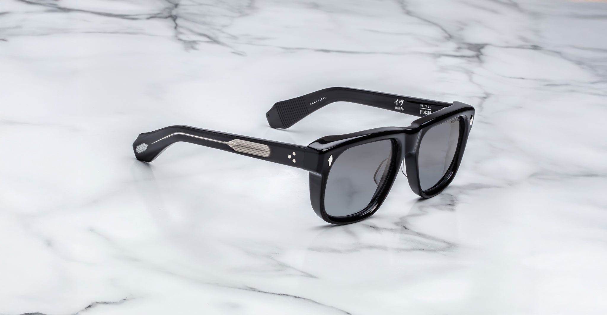 Jacques Marie Mage Yves black rectangular sunglasses with thick frames, shown from above.