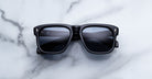Jacques Marie Mage Yves in Lacquer Blue sunglasses, rectangular dark blue acetate frame with blue-tinted lenses and signature arrowhead rivets, front view