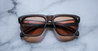 Jacques Marie Mage Yves square brown sunglasses with orange-tinted UV lenses, front view.