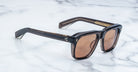 Jacques Marie Mage Yves sunglasses with brown-tinted rectangular lenses, front angle view.