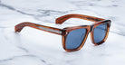 Jacques Marie Mage Yves sunglasses, brown rectangular frame with blue lenses, front view.