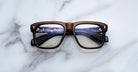 Jacques Marie Mage Yves brown rectangular eyeglasses with thick frames, front view.