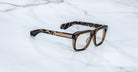 Jacques Marie Mage Yves eyeglasses with thick tortoiseshell frames, front view.
