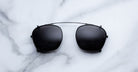 Jacques Marie Mage Zephirin 47 Clip On 2 black sunglasses with thin metal bridge, top view.