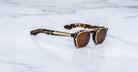 Jacques Marie Mage Zephirin 47 Clip On 2 sunglasses, brown lenses, gold accents, front view.