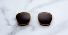 Jacques Marie Mage Zephirin 47 Clip On 2 sunglasses, top view, featuring round lenses and metal frame detailing.