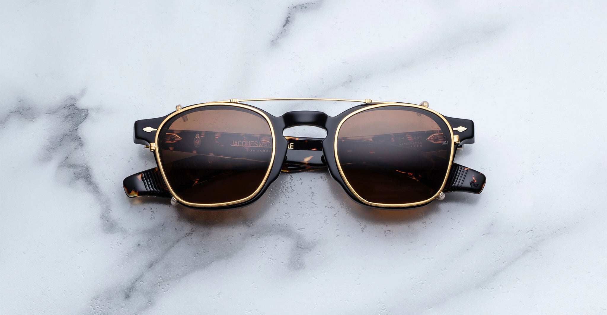 Jacques Marie Mage Zephirin 47 Clip On 2 sunglasses, brown lenses, gold-black frames, front view.