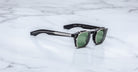 Jacques Marie Mage Zephirin 47 Clip On 2 sunglasses, green lenses, silver accents, front angle view.