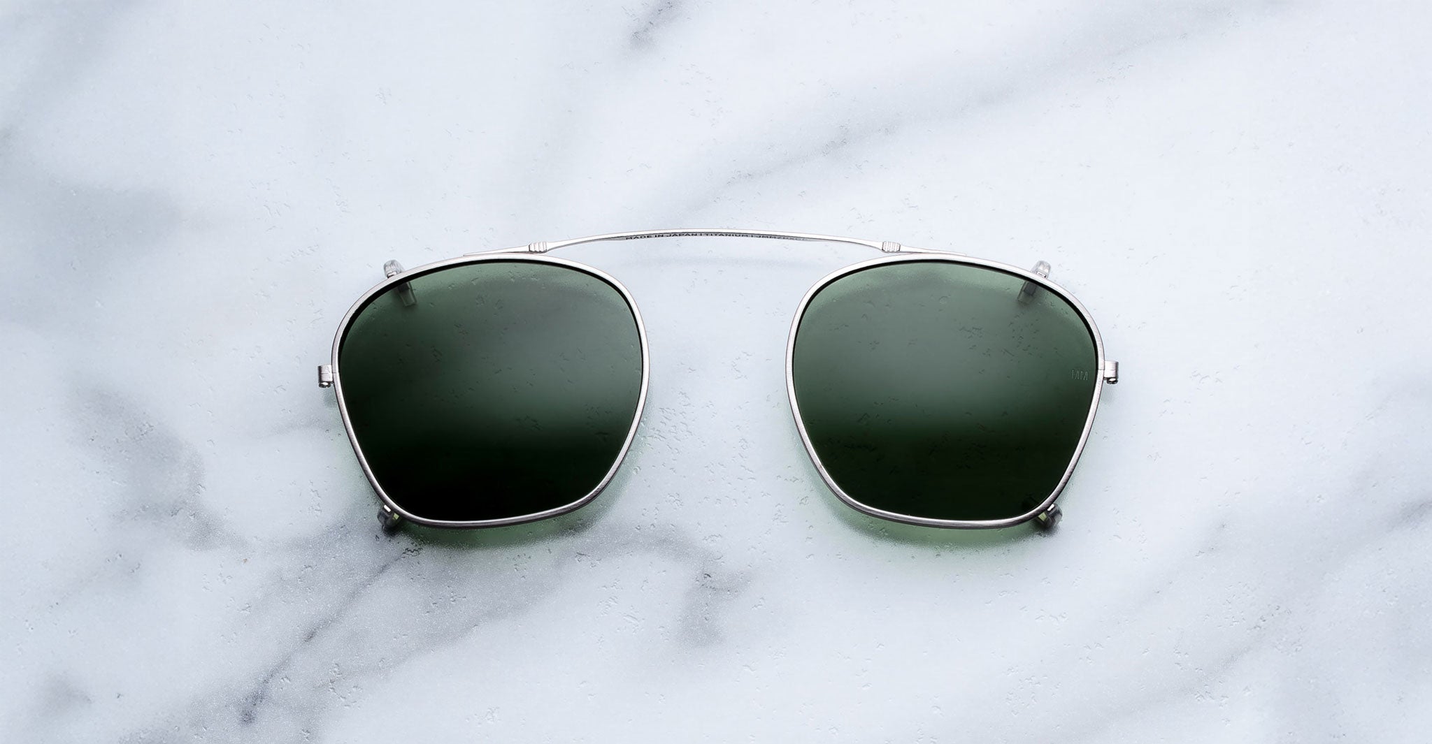 Jacques Marie Mage Zephirin 47 Clip On 2 sunglasses displayed from above, showing both lenses and frame details.