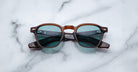 Jacques Marie Mage Zephirin 47 brown sunglasses with blue-green lenses, front view.