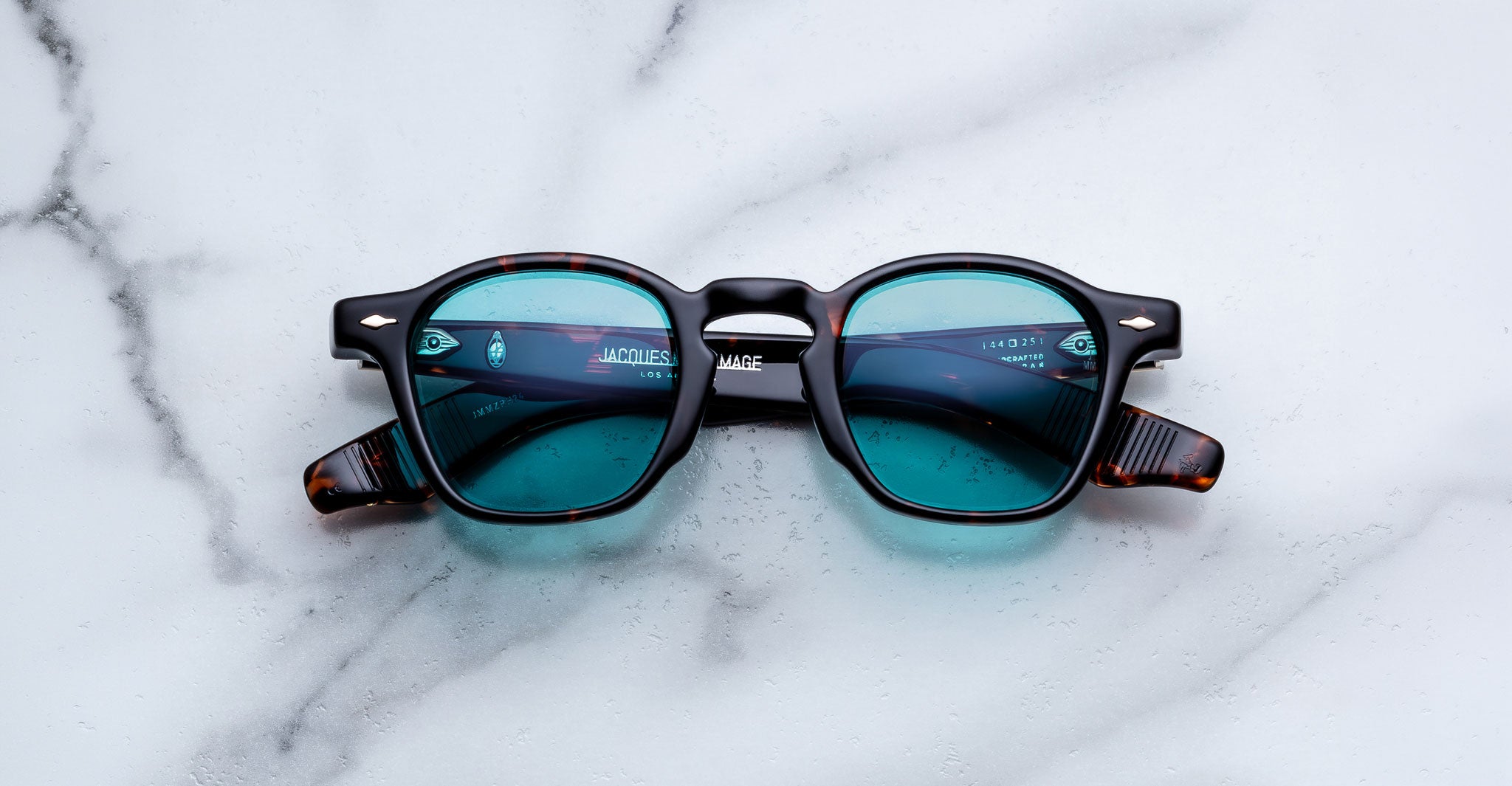 Jacques Marie Mage Zephirin sunglasses in Aegen, front view with turquoise lenses and dark tortoiseshell acetate frame.