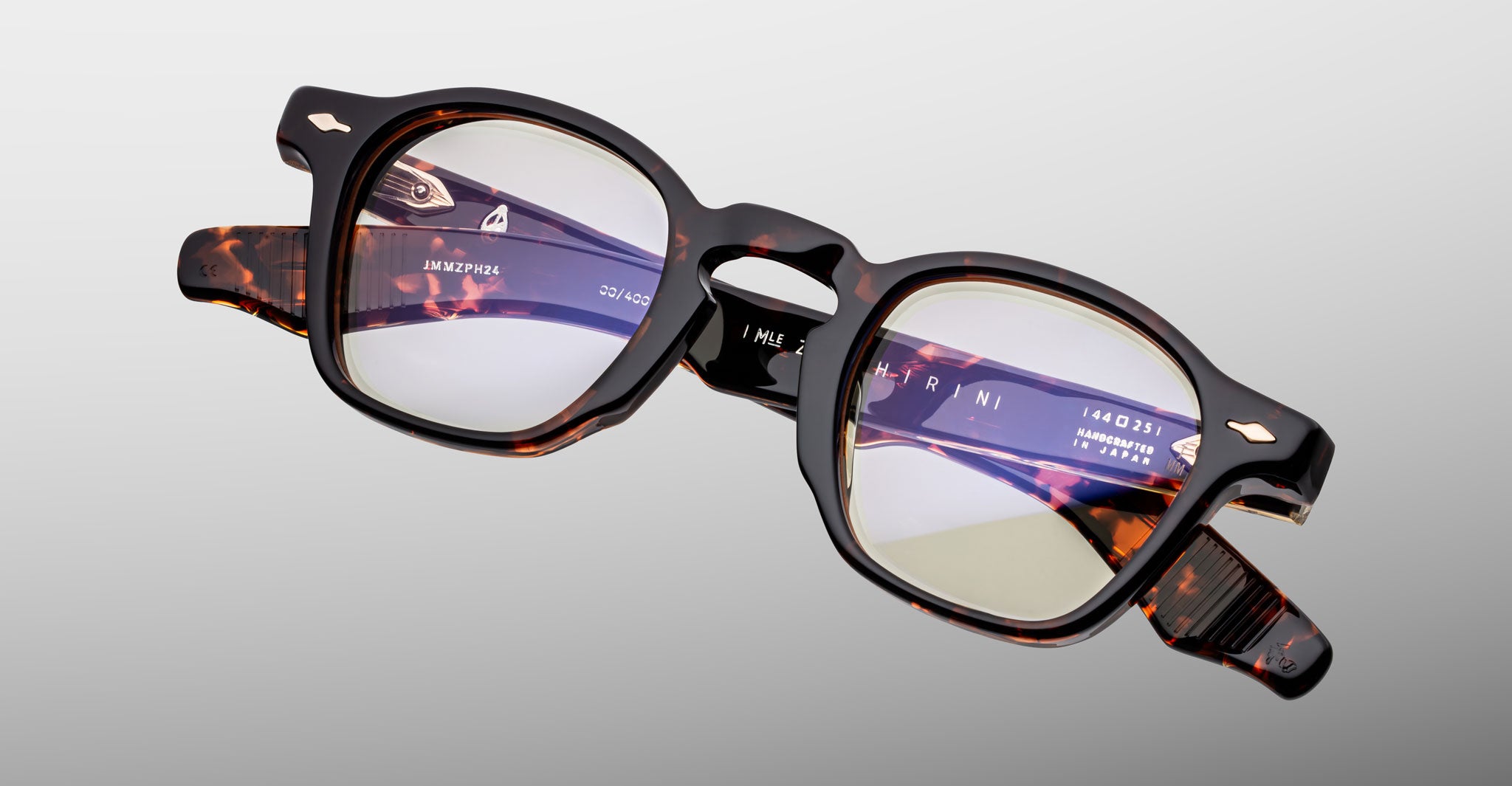 Jacques Marie Mage Zephirin optical frame in Aegen, angled front detail showing dark tortoiseshell acetate and gold-tone accents.