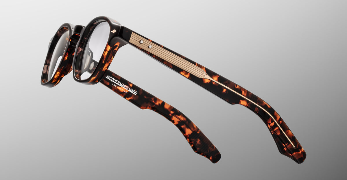 Jacques Marie Mage Zephirin optical frame in Aegen, side detail showing tortoiseshell acetate temples and gold-tone wirecore hardware.