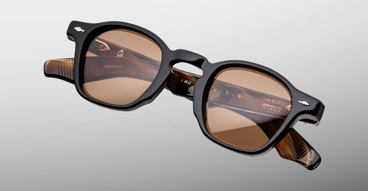 Jacques Marie Mage Zephirin sunglasses in Brun, angled front detail with dark brown acetate, warm brown lenses, and silver-tone accents.