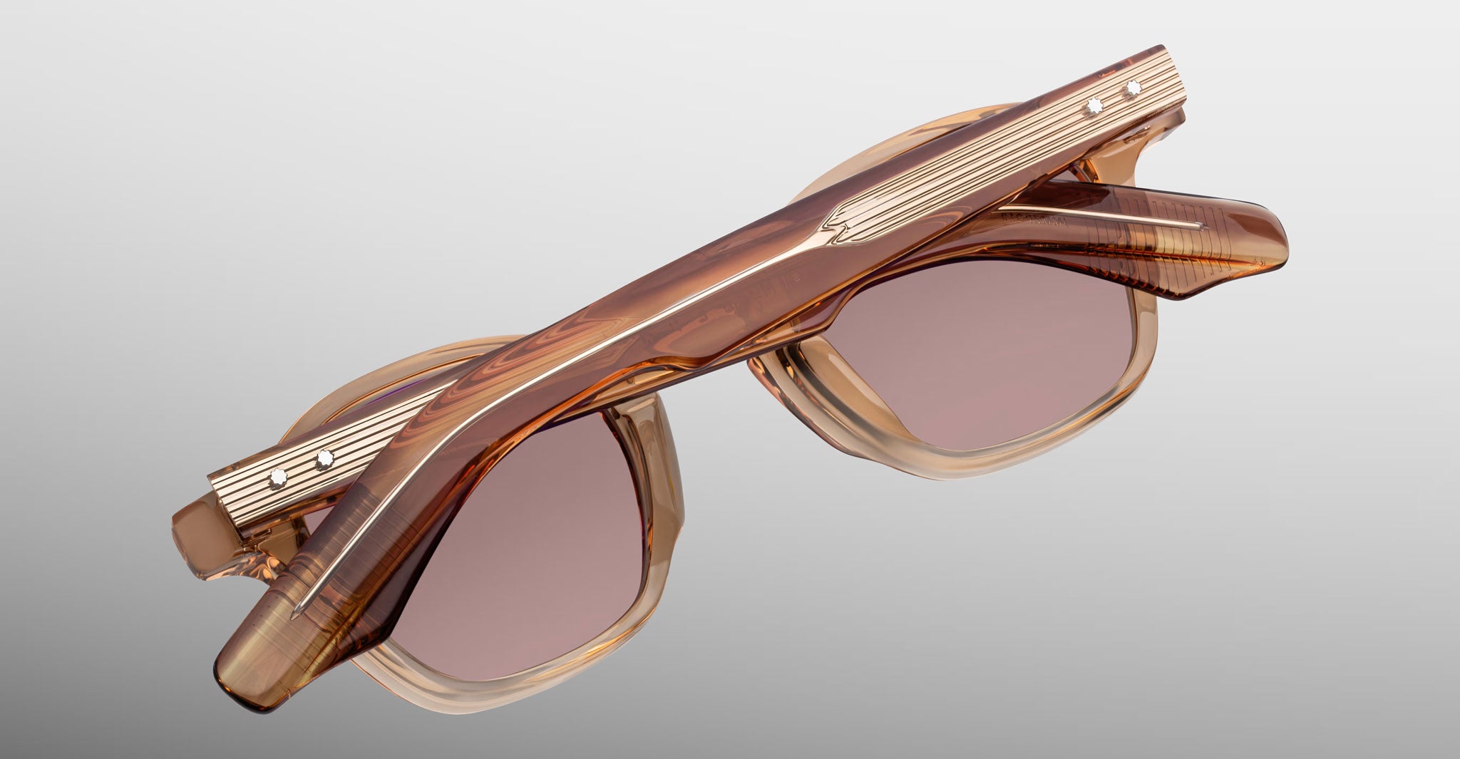 Jacques Marie Mage Zephirin sunglasses in Casliza, rear detail showing translucent amber acetate, rose-tinted lenses, and gold-tone wirecore hardware.