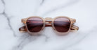 Jacques Marie Mage Zephirin sunglasses in Casliza, front view with translucent amber acetate and rose-tinted lenses.