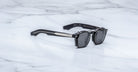Jacques Marie Mage Zephirin Clip On 2 round sunglasses with thick frames, viewed from above.