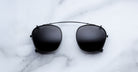 Jacques Marie Mage Zephirin Clip On 2 sunglasses shown from above, highlighting the frame design and brand details.