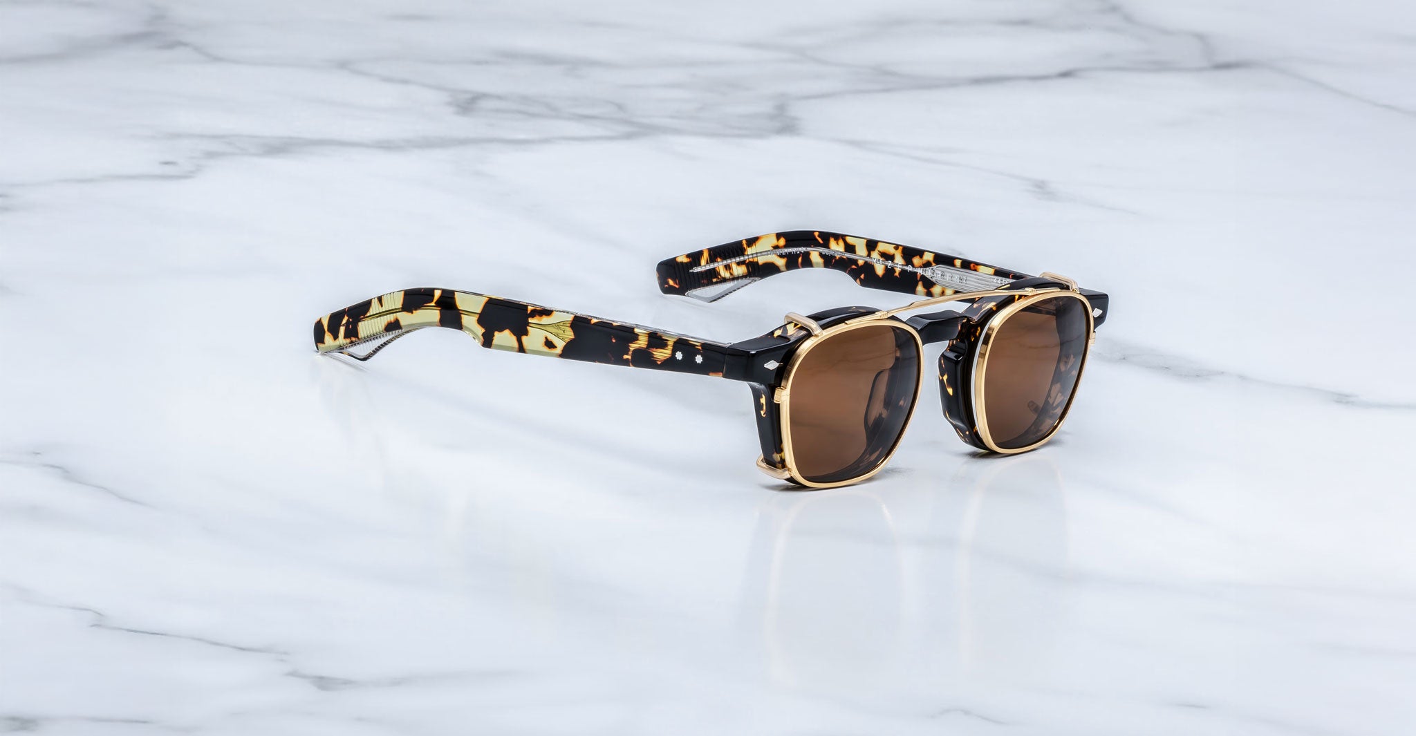 Jacques Marie Mage Zephirin Clip On 2 sunglasses, brown lenses, black-yellow tortoiseshell frames, front view.