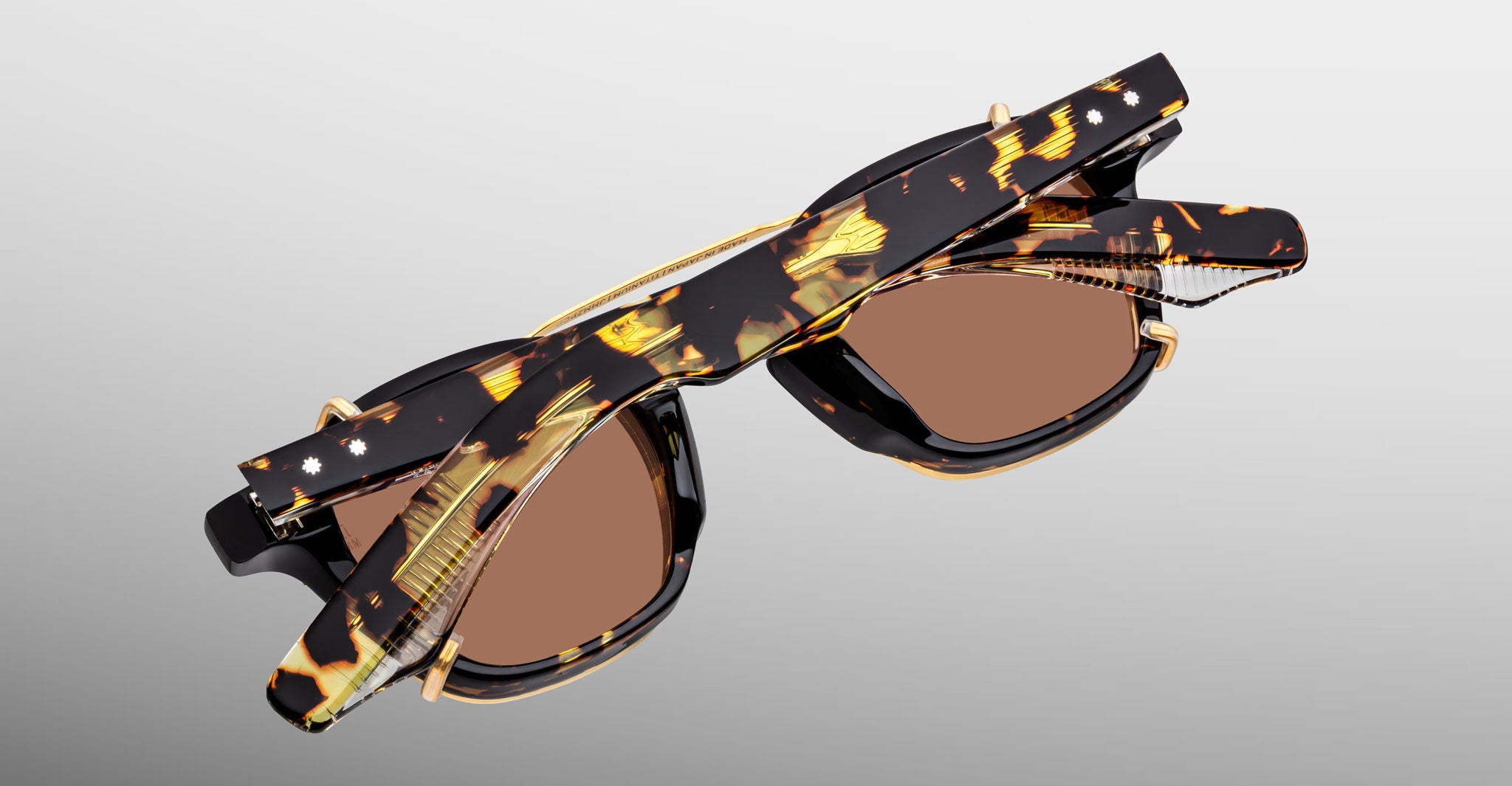 Jacques Marie Mage Zephirin Clip On 2 tortoiseshell sunglasses with brown lenses, top view, showing full frame and clip-on design.
