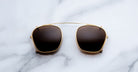 Jacques Marie Mage Zephirin Clip On 2 sunglasses shown from above, with frames and clip-on lenses visible.