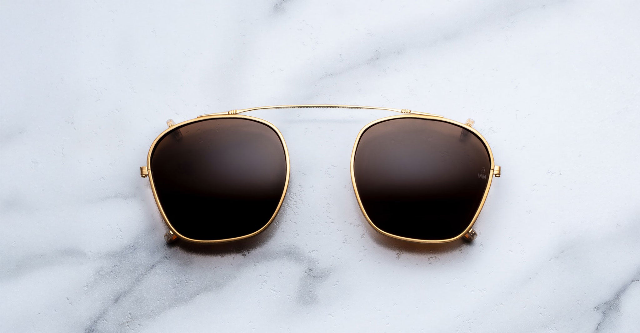 Jacques Marie Mage Zephirin Clip On 2 sunglasses shown from above, with frames and clip-on lenses visible.