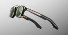 Jacques Marie Mage Zephirin Clip On 2 sunglasses with metallic frames and green lenses, shown from a front angle.