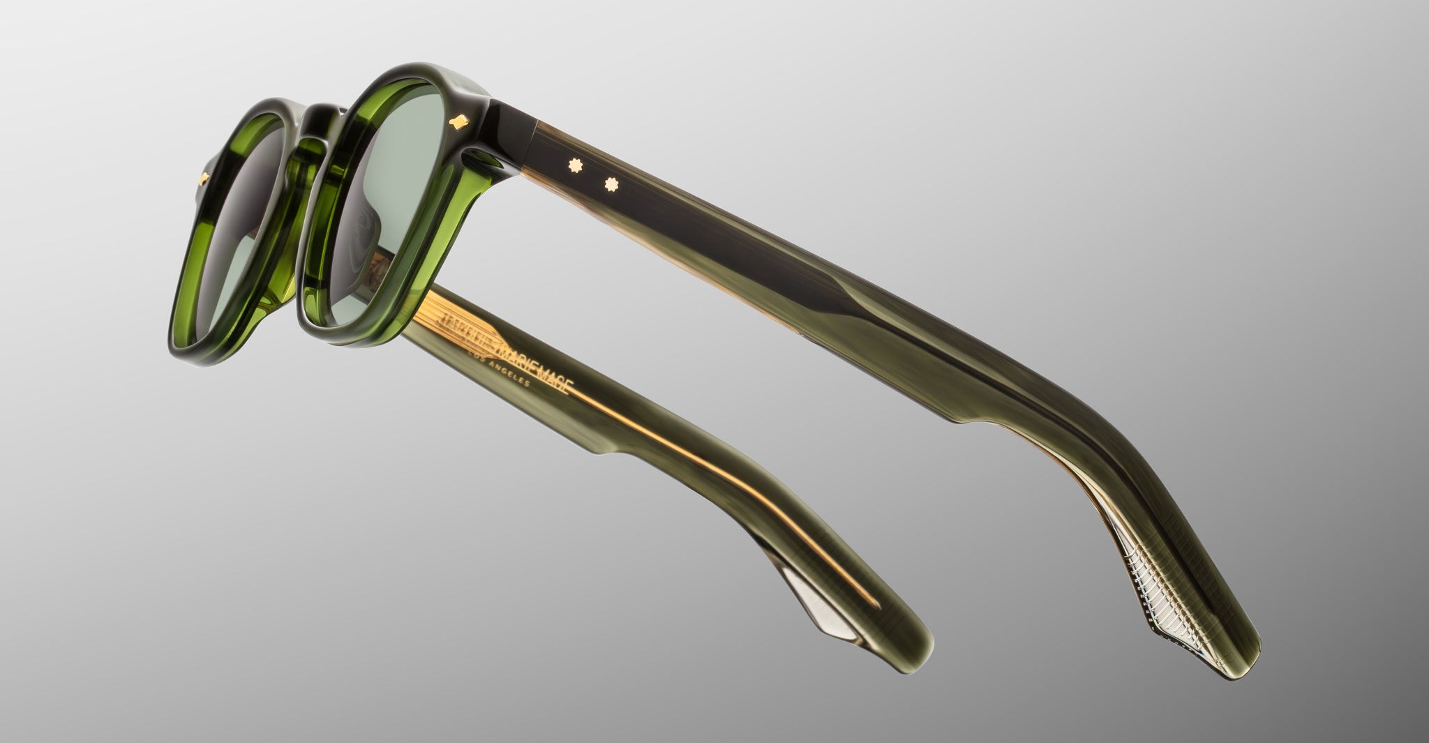 Jacques Marie Mage Zephirin sunglasses in Kombu, side detail showing translucent olive green acetate temples and gold-tone hardware.