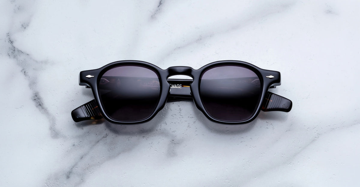 Jacques Marie Mage Zephirin sunglasses in Noir 11, front view with glossy black acetate and gray gradient lenses.