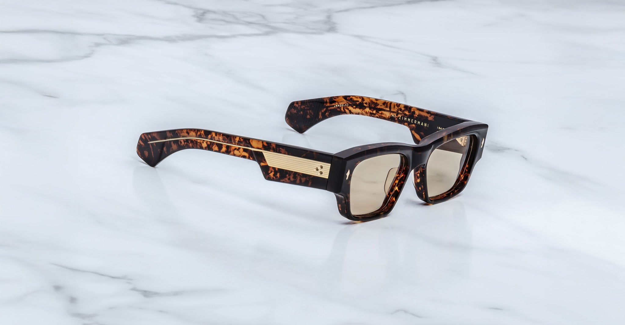 Jacques Marie Mage Zimmerman sunglasses in tortoise acetate with bold rectangular silhouette, light tinted lenses, and signature metal temple detail, angled view