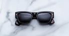 Jacques Marie Mage Zimmerman sunglasses in Bloodstone black acetate with bold rectangular frame, dark tinted lenses, and signature arrowhead front pins, front view