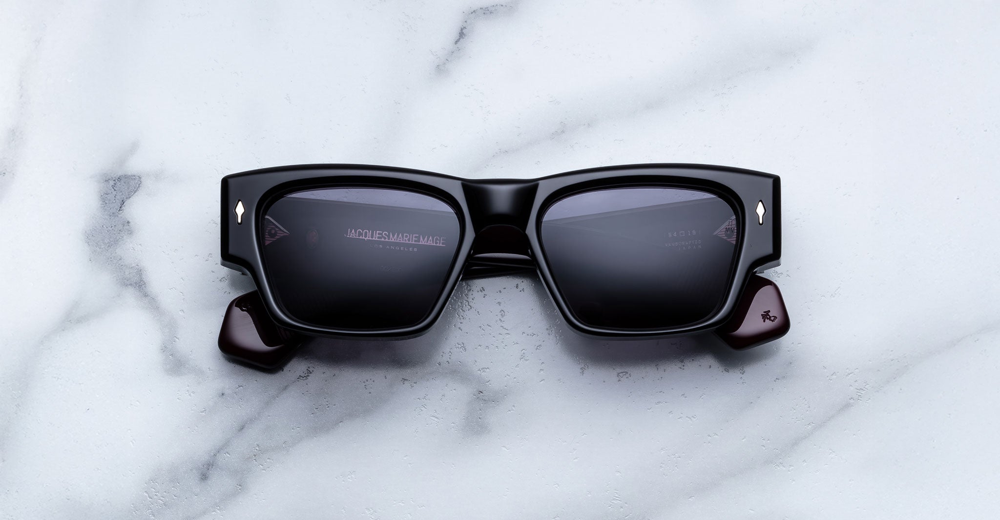 Jacques Marie Mage Zimmerman sunglasses in Bloodstone black acetate with bold rectangular frame, dark tinted lenses, and signature arrowhead front pins, front view