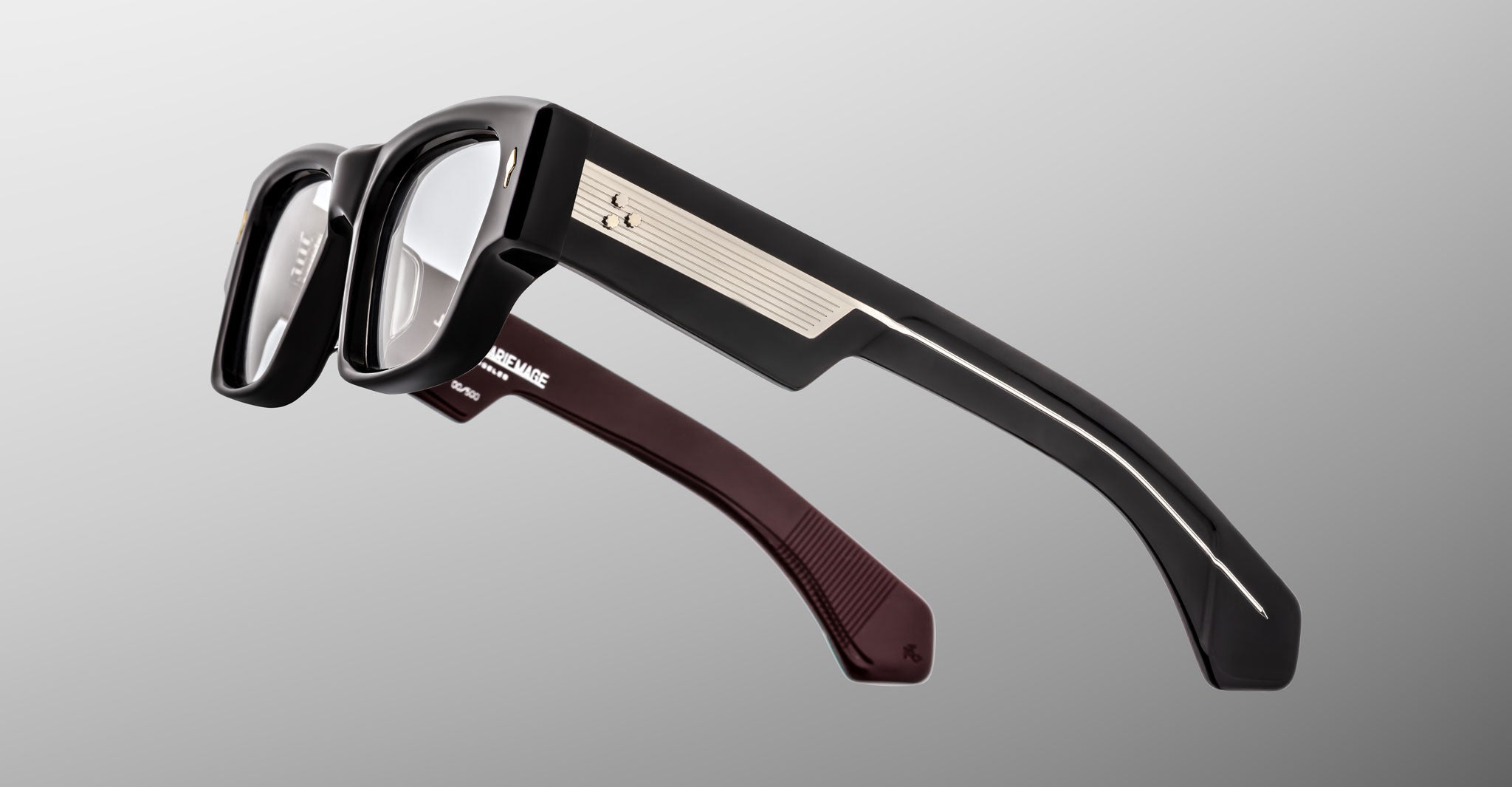 Jacques Marie Mage Zimmerman optical glasses in Bloodstone black acetate with bold rectangular frame, clear lenses, and wide temples with signature metal core detail, side view