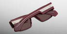 Jacques Marie Mage Zimmerman sunglasses in Bordeaux Empire red acetate with bold rectangular frame, brown tinted lenses, and wide temples with signature metal wirecore detail, back view