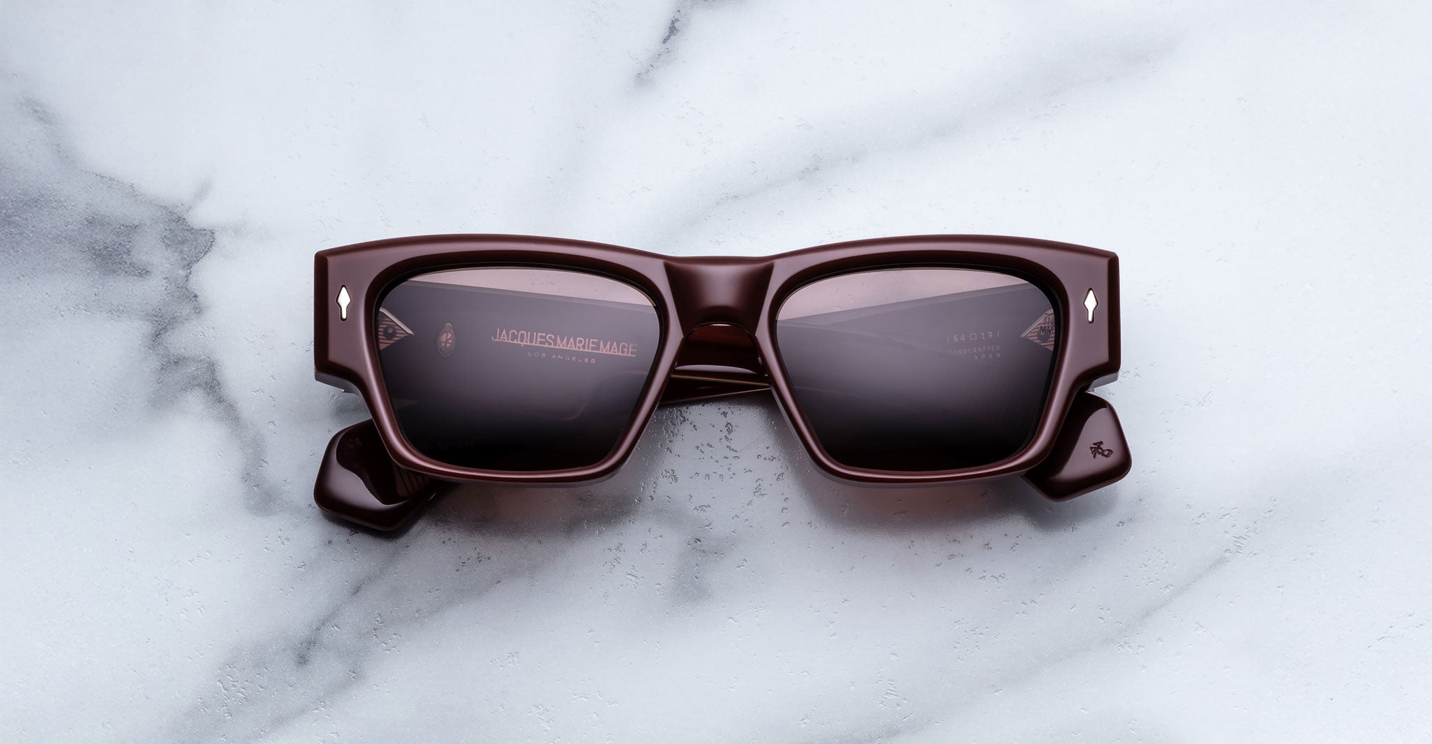 Jacques Marie Mage Zimmerman sunglasses in Bordeaux Empire red acetate with bold rectangular frame, dark tinted lenses, and signature arrowhead front pins, front view