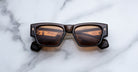 Jacques Marie Mage Zimmerman sunglasses in London brown acetate with bold rectangular frame, brown tinted lenses, and signature arrowhead front pins, front view