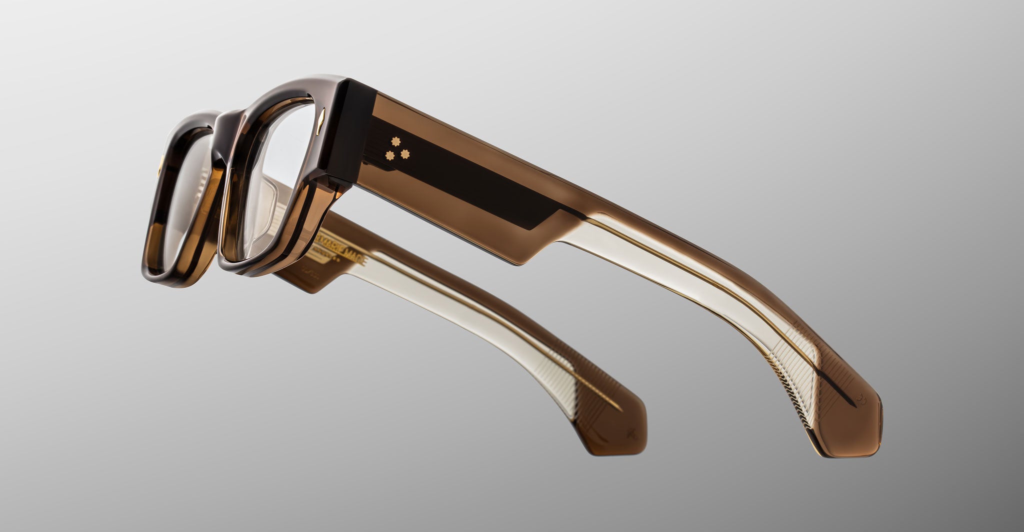 Jacques Marie Mage Zimmerman optical glasses in London brown acetate with bold rectangular frame, clear lenses, and wide temples with signature metal wirecore detail, side view