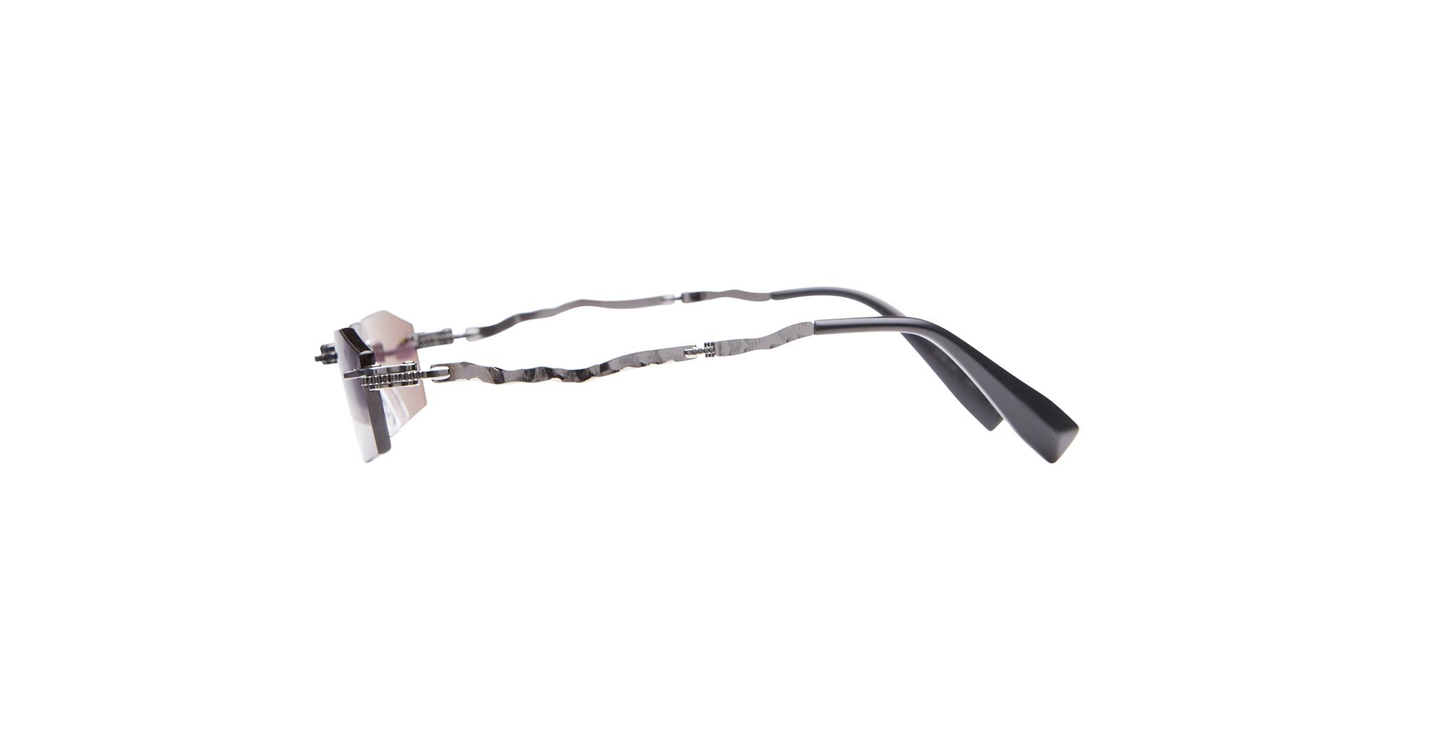 A pair of eyeglasses with thin, wavy metal arms and black plastic temple tips, shown from the side against a white background.