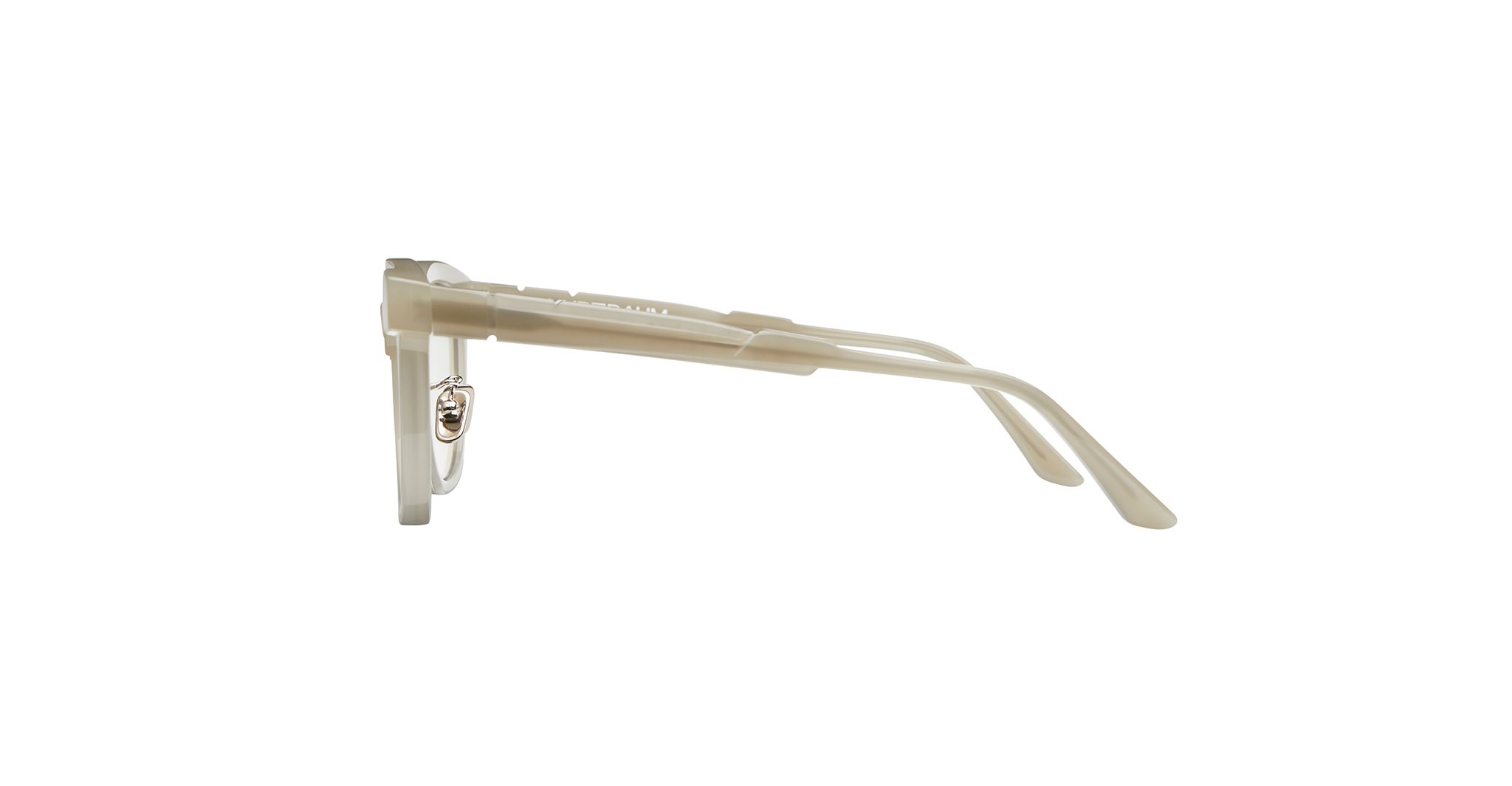 Side view of translucent beige eyeglass frames with clear lenses and a small metallic detail on the inside of the left temple arm, set against a plain white background.